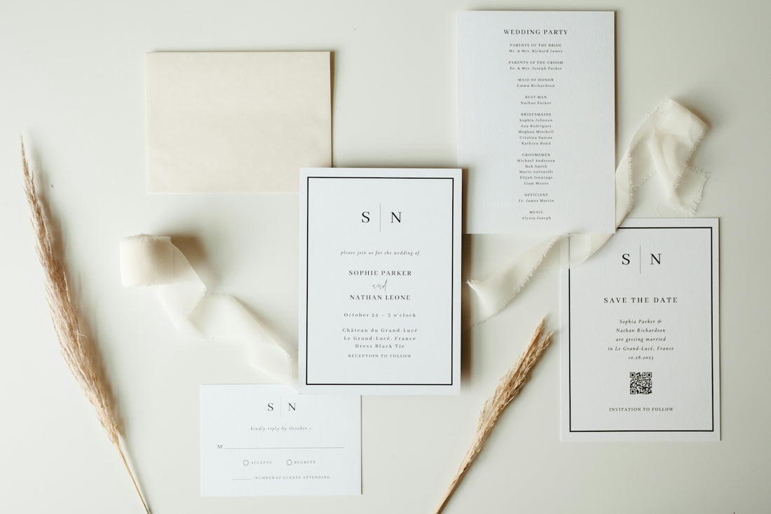 Wedding stationery suite with neutral ribbon and dried flowers